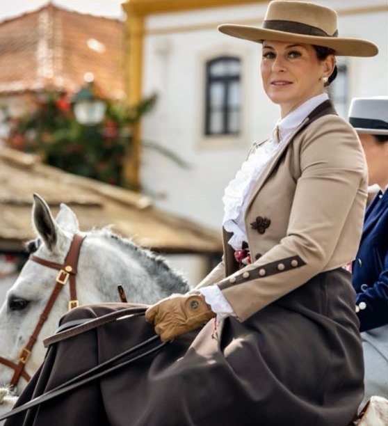 Marta Botelho riding side-saddle in traditional Portuguese dress